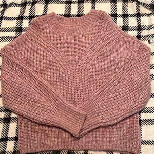 Pink chunky knitted sweater.